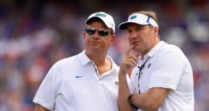 University of Florida defensive line coach Sal Sunseri confers with head coach Dan Mullen during the 2018 Orange and Blue game- Florida Gators football- 1280x853