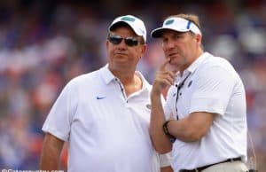 University of Florida defensive line coach Sal Sunseri confers with head coach Dan Mullen during the 2018 Orange and Blue game- Florida Gators football- 1280x853