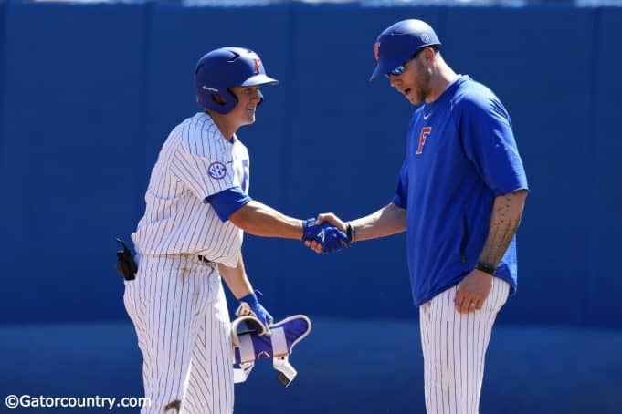 University of Florida infielder Blake Reese shakes Lars Davis’ hand after a single against Auburn- Florida Gators baseball- 1280x853