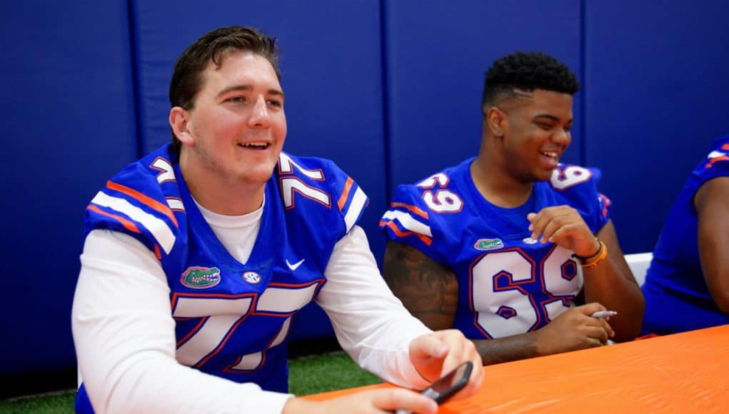 University of Florida offensive lineman Andrew Mike signs autographs at the Gators fan day in 2017- Florida Gators football- 1280x854