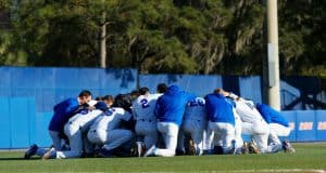 The University of Florida Gators baseball team says a group prayer before their game against the Florida State Seminoles- Florida Gators baseball- 1280x853