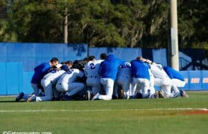 The University of Florida Gators baseball team says a group prayer before their game against the Florida State Seminoles- Florida Gators baseball- 1280x853