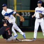 Jun 17, 2018; Omaha, NE, USA; Texas Tech Red Raiders center fielder Cody Farhat (1) slides into second base as Florida Gators second baseman Blake Reese (12) completes a double play with shortstop Deacon Liput (8) watching in the third inning during the College World Series at TD Ameritrade Park. Mandatory Credit: Steven Branscombe-USA TODAY Sports