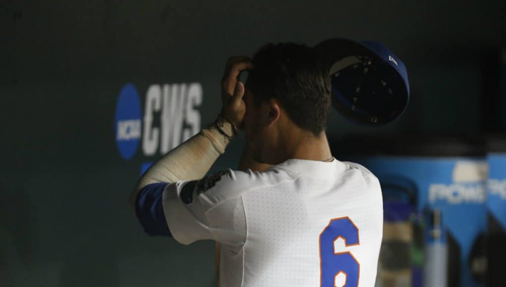 Jun 22, 2018; Omaha, NE, USA; Florida Gators third baseman Jonathan India (6) wipes his face after losing to the Arkansas Razorbacks in the College World Series at TD Ameritrade Park. Mandatory Credit: Bruce Thorson-USA TODAY Sports