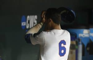 Jun 22, 2018; Omaha, NE, USA; Florida Gators third baseman Jonathan India (6) wipes his face after losing to the Arkansas Razorbacks in the College World Series at TD Ameritrade Park. Mandatory Credit: Bruce Thorson-USA TODAY Sports