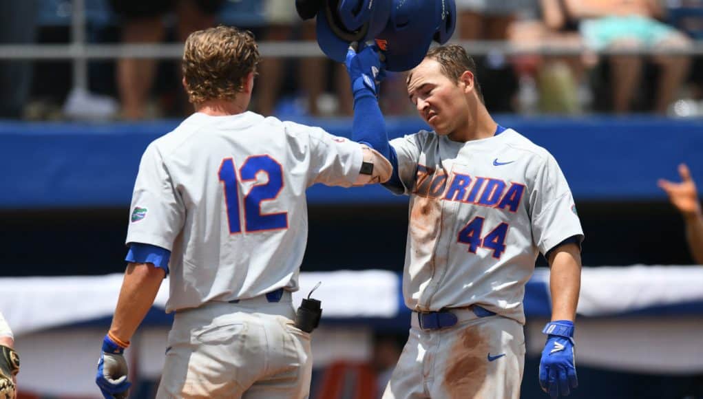 University of Florida outfielder Austin Langworthy is greeted by Blake Reese after Langworthy’s game tying home run in the Gainesville Super Regional- Florida Gators baseball- 1280x853