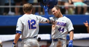 University of Florida outfielder Austin Langworthy is greeted by Blake Reese after Langworthy’s game tying home run in the Gainesville Super Regional- Florida Gators baseball- 1280x853
