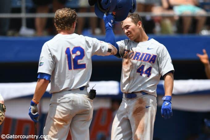 University of Florida outfielder Austin Langworthy is greeted by Blake Reese after Langworthy’s game tying home run in the Gainesville Super Regional- Florida Gators baseball- 1280x853