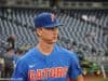 University of Florida pitcher Brady Singer walks out on to the field at TD Ameritrade Park prior to the Florida Gators second game against Texas Tech- Florida Gators baseball- 1280x850