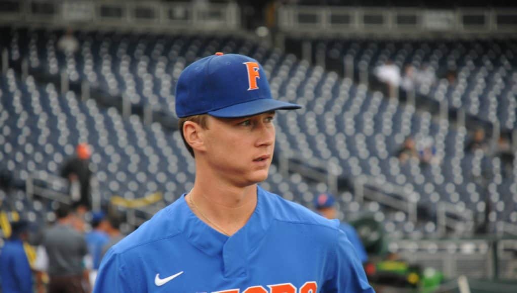University of Florida pitcher Brady Singer walks out on to the field at TD Ameritrade Park prior to the Florida Gators second game against Texas Tech- Florida Gators baseball- 1280x850