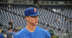 University of Florida pitcher Brady Singer walks out on to the field at TD Ameritrade Park prior to the Florida Gators second game against Texas Tech- Florida Gators baseball- 1280x850