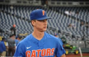 University of Florida pitcher Brady Singer walks out on to the field at TD Ameritrade Park prior to the Florida Gators second game against Texas Tech- Florida Gators baseball- 1280x850