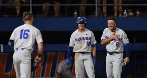 University of Florida third baseman Jonathan India and Blake Reese meet Wil Dalton at the plate after his home run against Jacksonville in the Gainesville Regional- Florida Gators baseball- 1280x853