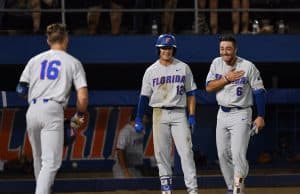 University of Florida third baseman Jonathan India and Blake Reese meet Wil Dalton at the plate after his home run against Jacksonville in the Gainesville Regional- Florida Gators baseball- 1280x853