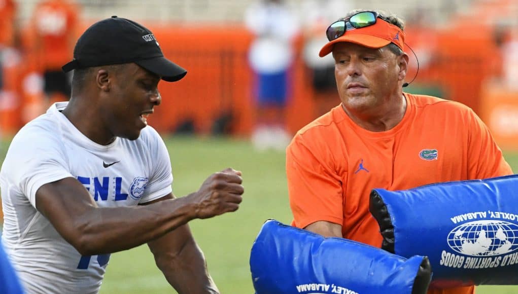 University of Florida defensive coordinator Todd Grantham goes through pass rushing drills with campers during Friday Night Lights- Florida Gators football- 1280x853