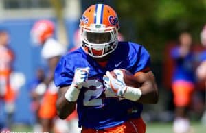 University of Florida freshman Iverson Clement carries the ball during a running backs drill in spring practice- Florida Gators football- 1280x854