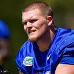 University of Florida offensive guard Brett Heggie takes a knee while Dan Mullen addresses the Florida Gators after their second spring practice- Florida Gators football- 1280x853