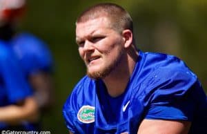 University of Florida offensive guard Brett Heggie takes a knee while Dan Mullen addresses the Florida Gators after their second spring practice- Florida Gators football- 1280x853