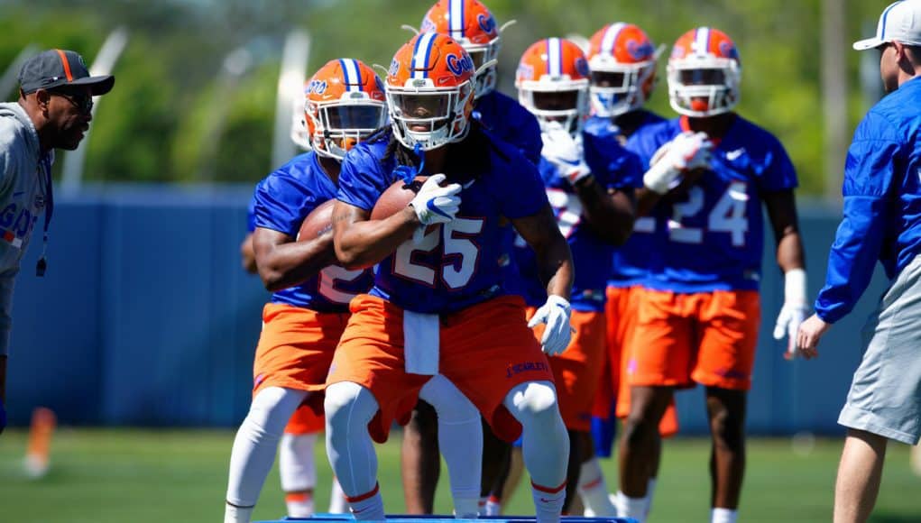 University of Florida running backs coach Greg Knox takes his players through a drill during spring football camp- Florida Gators football- 1280x853