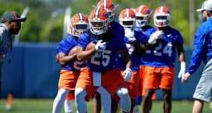 University of Florida running backs coach Greg Knox takes his players through a drill during spring football camp- Florida Gators football- 1280x853