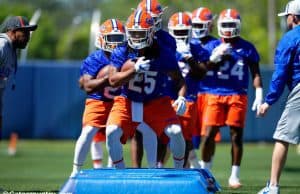 University of Florida running backs coach Greg Knox takes his players through a drill during spring football camp- Florida Gators football- 1280x853