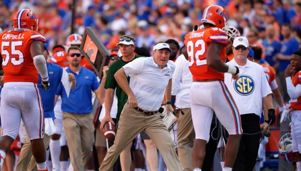 Florida Gators head coach Dan Mullen congratulates Jabari Zuniga on a sack- 1280x853