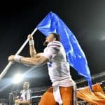 Florida Gators quarterback Feleipe Franks carries the Florida flag after defeating Mississippi State- 1280x854
