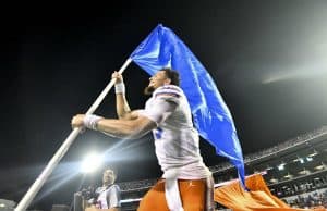 Florida Gators quarterback Feleipe Franks carries the Florida flag after defeating Mississippi State- 1280x854