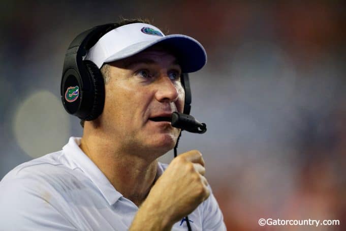 University of Florida head coach Dan Mullen calling in a play during the Florida Gators 53-6 win over Charleston Southern- Florida Gators football- 1280x853