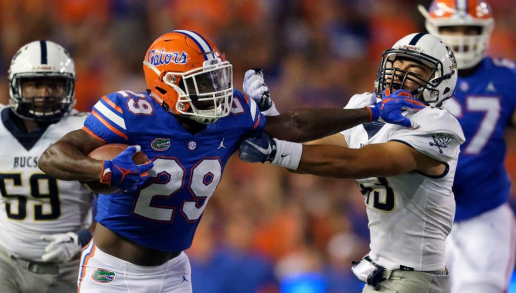 University of Florida running back Dameon Pierce stiff arms a defender during the Florida Gators 53-6 win over Charleston Southern- Florida Gators football- 1280x853