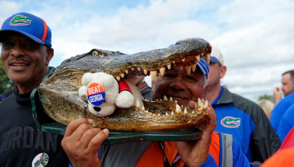 Florida Gators fans hold a Gator head before Gator Walk-1280x852