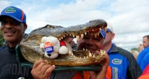 Florida Gators fans hold a Gator head before Gator Walk-1280x852
