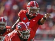 Sep 1, 2018; Athens, GA, USA; Georgia Bulldogs quarterback Justin Fields (1) calls a play behind center Lamont Gaillard (53) against the Austin Peay Governors during the first half at Sanford Stadium. Mandatory Credit: Dale Zanine-USA TODAY Sports