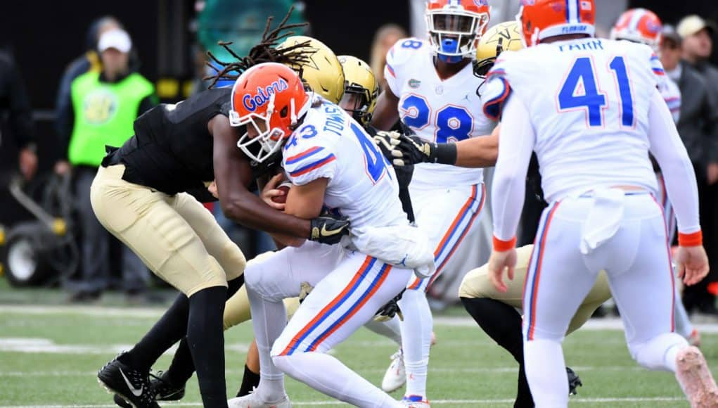 Oct 13, 2018; Nashville, TN, USA; Florida Gators punter Tommy Townsend (43) runs for a first down on a fake punt during the second half against the Vanderbilt Commodores at Vanderbilt Stadium. Mandatory Credit: Christopher Hanewinckel-USA TODAY Sports