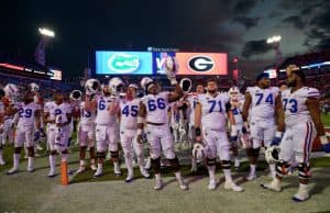 University of Florida football players stand on the field and sing the alma mater after a 36-17 loss to the Georgia Bulldogs- Florida Gators football- 1280x852