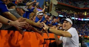 University of Florida head coach Dan Mullen does a victory lap around Ben Hill Griffin Stadium after the Florida Gators win over LSU- Florida Gators football- 1280x852