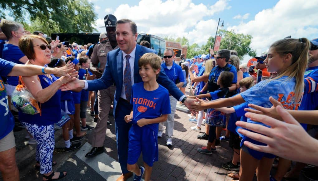 University of Florida head football coach Dan Mullen walks into Ben Hill Griffin Stadium with his son before the Gators host LSU- Florida Gators football- 1280x852