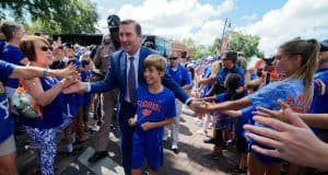 University of Florida head football coach Dan Mullen walks into Ben Hill Griffin Stadium with his son before the Gators host LSU- Florida Gators football- 1280x852
