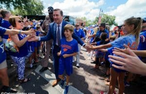 University of Florida head football coach Dan Mullen walks into Ben Hill Griffin Stadium with his son before the Gators host LSU- Florida Gators football- 1280x852