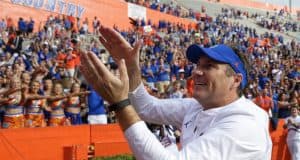 Florida Gators head coach Dan Mullen does the Gator Chomp after South Carolina- 1280x852