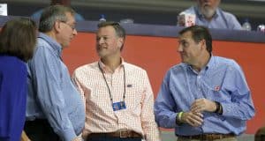 Dec 20, 2017; Gainesville, FL, USA; Florida Gators president Kent Fuchs, athletic director Scott Stricklin, and head football coach Dan Mullen talks during the second half against the James Madison Dukes at Exactech Arena at the Stephen C. O'Connell Center. Mandatory Credit: Kim Klement-USA TODAY Sports