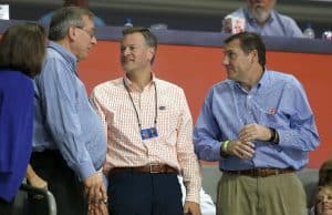 Dec 20, 2017; Gainesville, FL, USA; Florida Gators president Kent Fuchs, athletic director Scott Stricklin, and head football coach Dan Mullen talks during the second half against the James Madison Dukes at Exactech Arena at the Stephen C. O'Connell Center. Mandatory Credit: Kim Klement-USA TODAY Sports