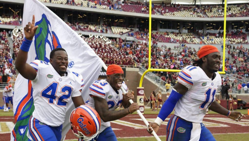 University of Florida players Umstead Sanders, Chauncey Gardner and Vosean Joseph celebrate the Florida Gators 41-14 win over FSU- Florida Gators football- 1280x852