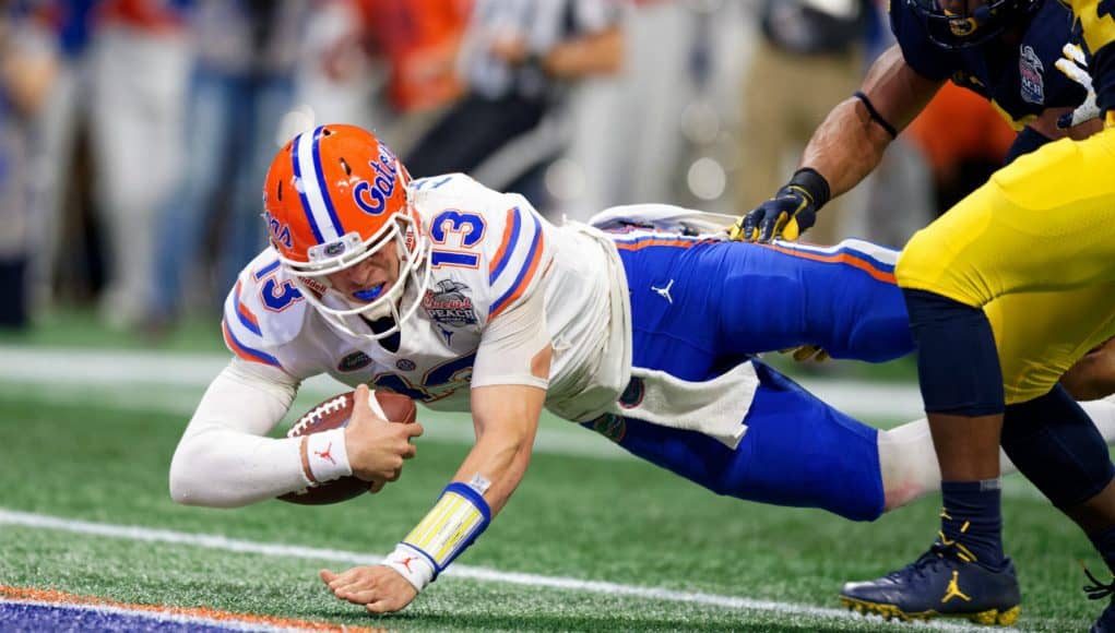 Florida Gators quarterback Feleipe Franks dives for a touchdown against Michigan-1280x853