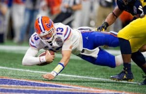 Florida Gators quarterback Feleipe Franks dives for a touchdown against Michigan-1280x853