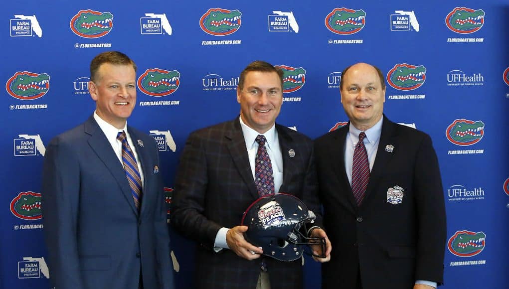 University of Florida athletic director Scott Stricklin and Dan Mullen pose with peach Bowl CEO and President Gary Stokan- Florida Gators football- 1280x1074