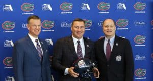 University of Florida athletic director Scott Stricklin and Dan Mullen pose with peach Bowl CEO and President Gary Stokan- Florida Gators football- 1280x1074