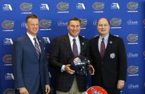 University of Florida athletic director Scott Stricklin and Dan Mullen pose with peach Bowl CEO and President Gary Stokan- Florida Gators football- 1280x1074