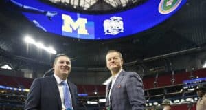 University of Florida football coach Dan Mullen and UF Athletic Director Scott Stricklin talking on the field before the 2018 Peach Bowl- Florida Gators football- 1280x852