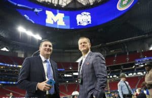 University of Florida football coach Dan Mullen and UF Athletic Director Scott Stricklin talking on the field before the 2018 Peach Bowl- Florida Gators football- 1280x852